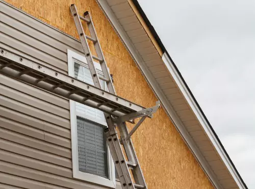 Siding installation is seen. Popejoy Roofing is a siding contractors in Champaign IL.