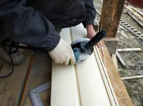 A worker is seen installing siding. Popejoy Roofing is the best of the Siding Companies in Pontiac IL.